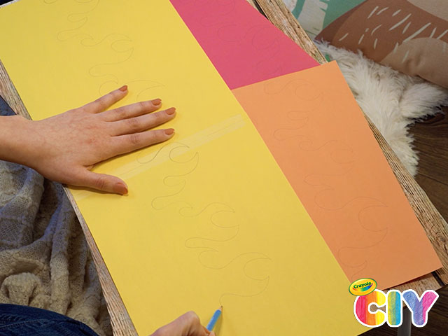 Stock Photo Child Cutting Yellow Construction Paper With Scissors