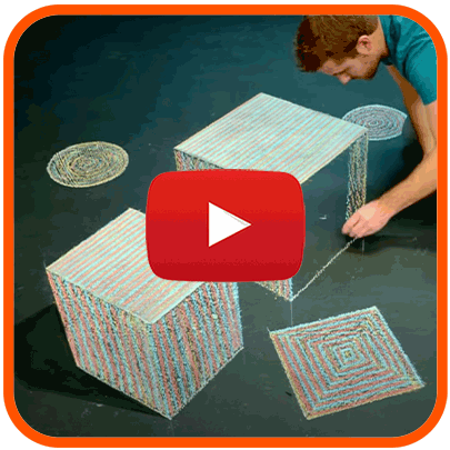 Video of artist drawing 3D cubes on asphalt