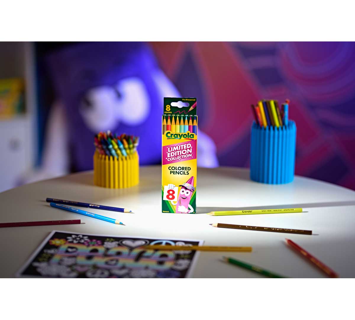 Limited Edition Retired Colored Pencils, 8 Count. Pencils and packaging on table with coloring page.