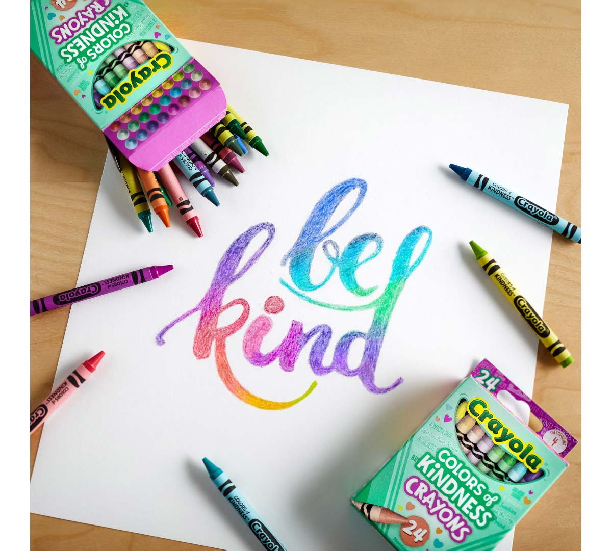 Colors of Kindness Crayons on top of be kind coloring page.