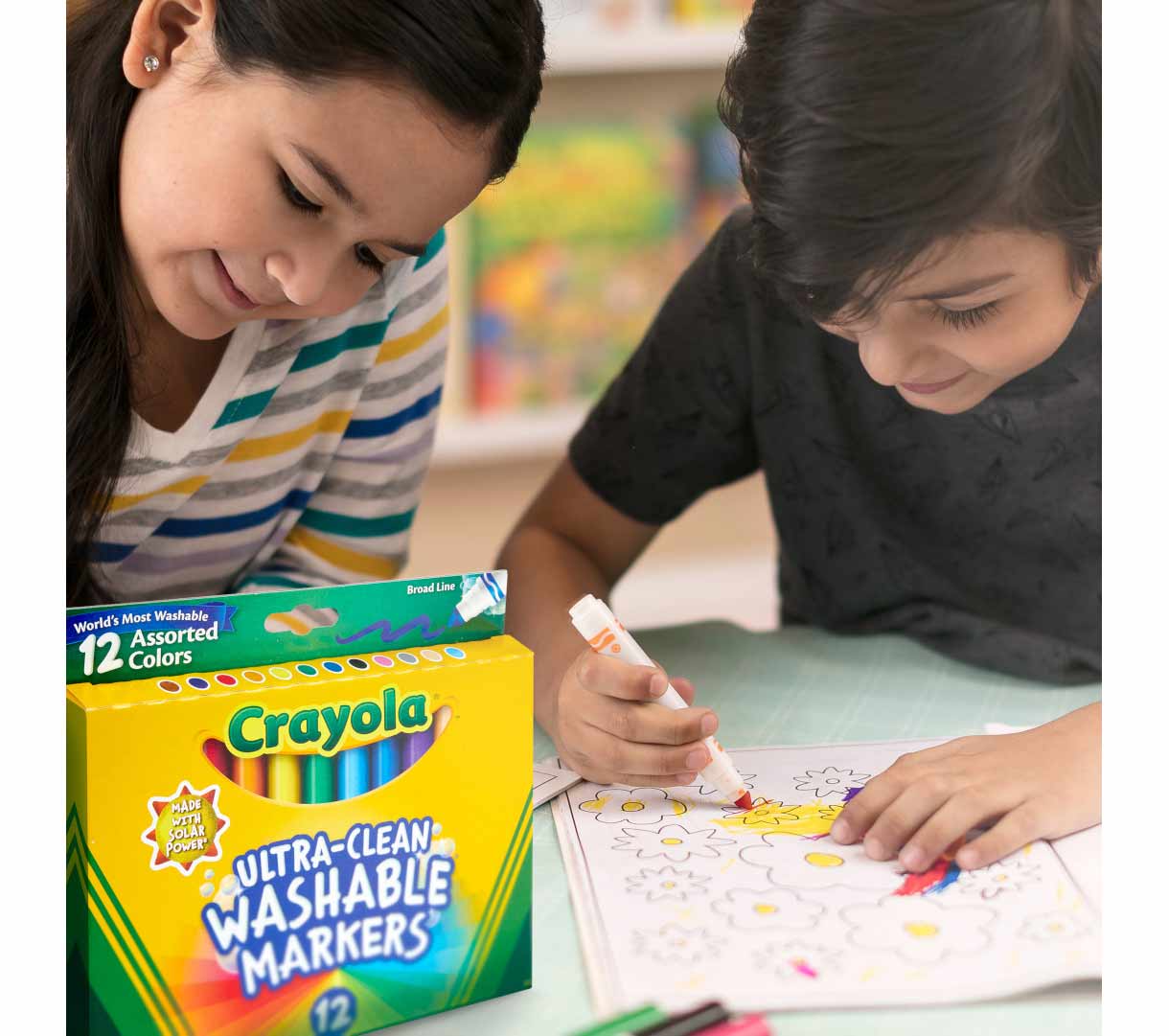 Ultra-Clean Washable Broad Line Markers on table. 2 kids coloring.
