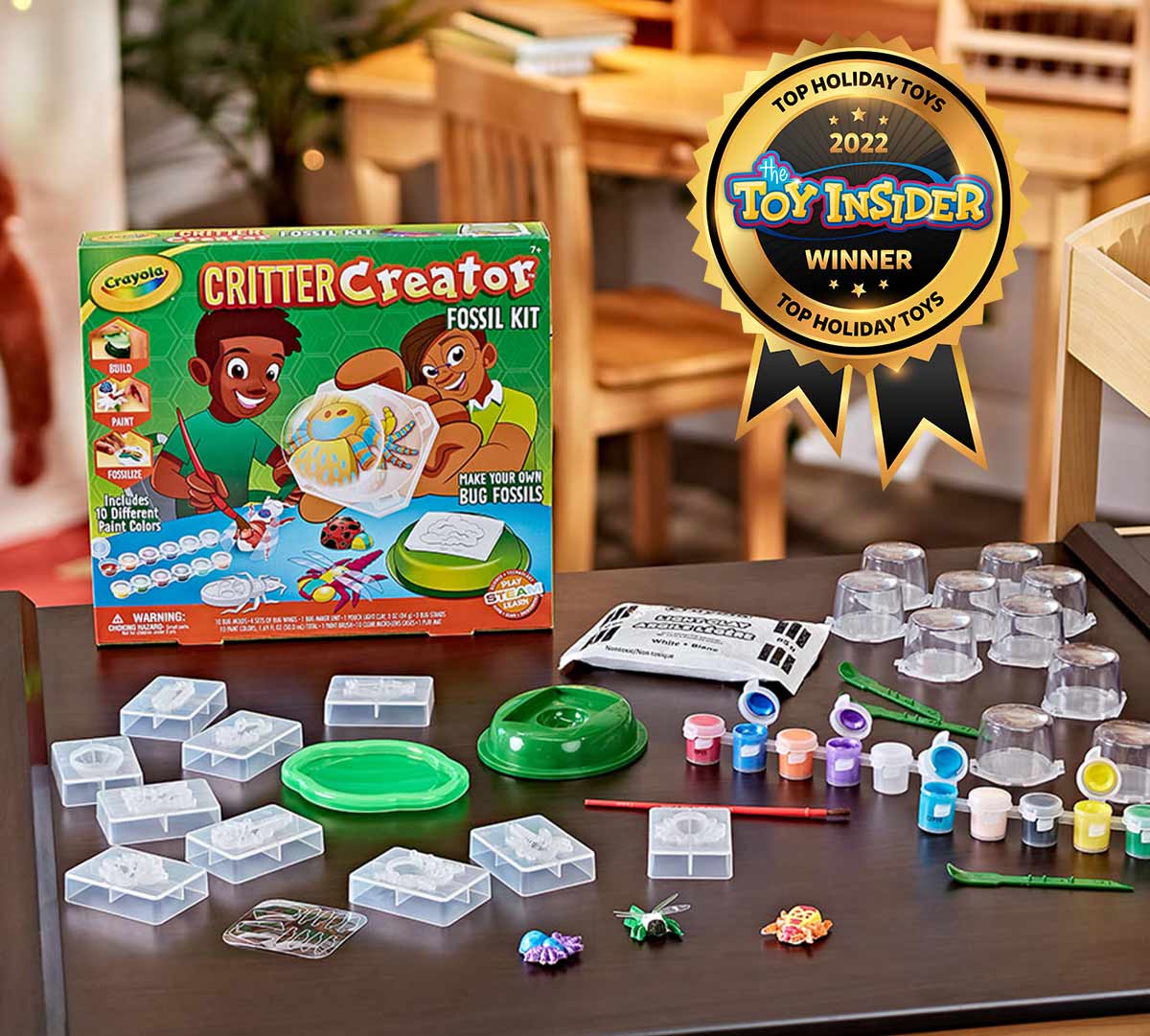 Critter Creator Metallic Bug Fossil Kit for Kids packaging and contents on table. Toy Insider 2022 award seal